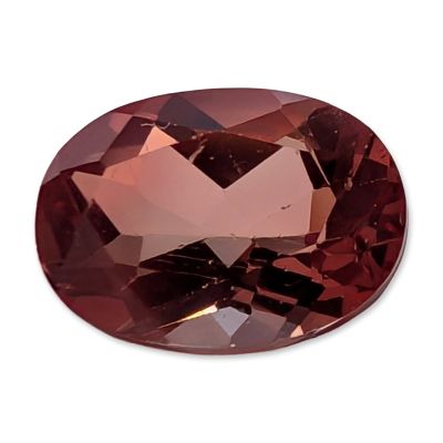 Oval Mixed Cut Pink Stone. Loose, faceted stone featuring an oval mixed cut exhibiting a vibrant 