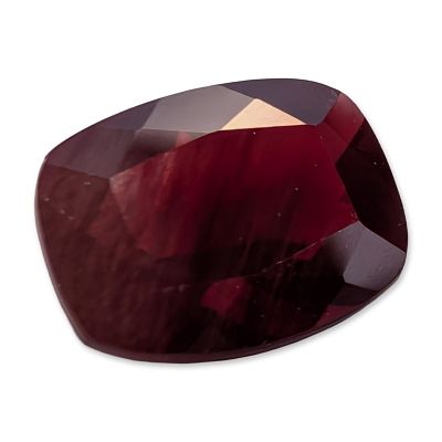 Cushion Cut Deep Red Stone. Loose faceted stone featuring a deep red color with purplish-pink 