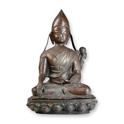 Large Tibetan Bronze Figure of a Seated Lama on Lotus Base. A finely modeled Tibetan bronze 
