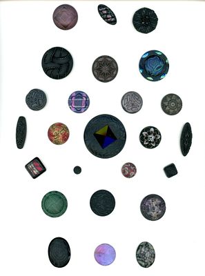 A CARD OF DIVISION ONE BLACK GLASS BUTTONS. 25 S/M/L 19th century assorted faux fabric examples. 