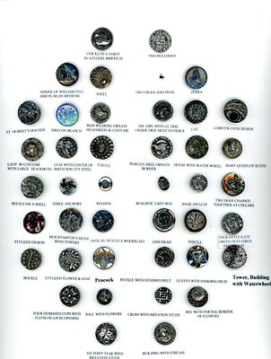 A CARD OF DIVISION ONE PICTORIAL BLACK GLASS BUTTONS. 41 Small late 19th century silver lustered 