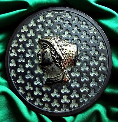 A DIVISION THREE PICTORIAL BLACK GLASS BUTTON. 1 Large 20th century silver lustered profile 