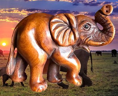 A CARVED JAPANESE WOOD NETSUKE ANIMAL. 1 Large carved and detailed full figured elephant 