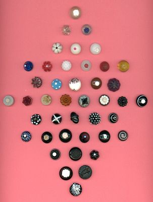 A CARD OF DIVISION ONE ASSORTED COLORED GLASS BUTTONS. 42 Small 19th century specialized to 