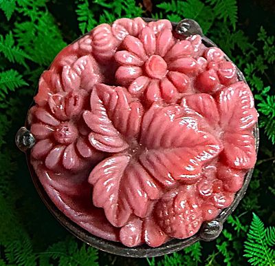 A DIVISION ONE GEMSTONE IN METAL BUTTON. 1 Medium size early 20th century carved coral in silver 