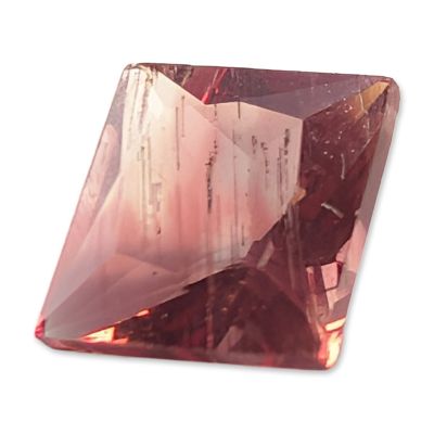 Lozenge Cut Pink Stone. Loose faceted stone featuring a lozenge-shaped cut. The stone displays a 