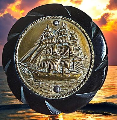 A DIVISION THREE PICTORIAL BAKELITE BUTTON. 1 Large 1940's Bakelite base with brass masted ship 