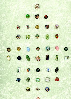 A CARD OF DIVISION ONE POPPER GLASS BUTTONS. 42 Small late 19th century assorted color and shape 