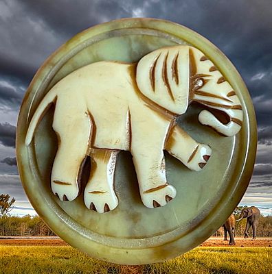 A DIVISION ONE CASEIN ANIMAL BUTTON. 1 Large early 20th century chunky elephant example. This 