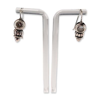 Pair of Sterling Silver and Colorless Stone Drop Earrings. A pair of sterling silver drop 