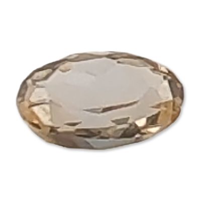 Oval Pale Champagne Faceted Topaz Gemstone. Loose faceted gemstone featuring an oval mixed cut 
