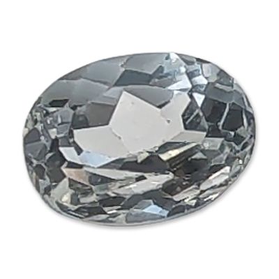 Oval Cut Pale Blue Topaz Gemstone. Loose faceted gemstone in a pale watery blue hue. The stone 