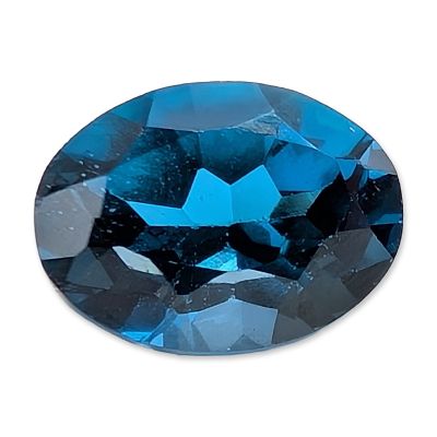 Oval Cut Blue Topaz Gemstone. A loose faceted gemstone that appears to be London blue topaz 