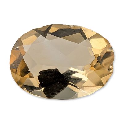Loose Oval Faceted Yellow Gemstone. Loose oval faceted yellow gemstone, which appears to be 