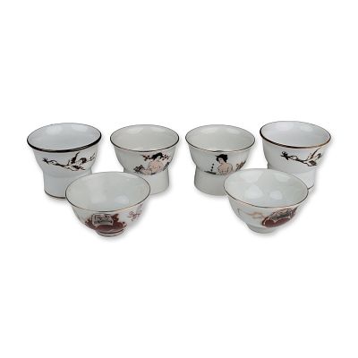 6pc Japanese Porcelain Hidden View and Daruma Sake Cup Collection. A collection of six Japanese 