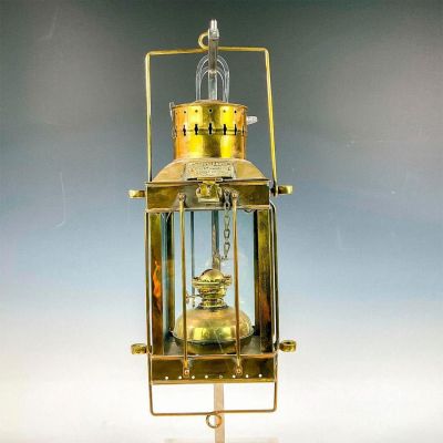 English Brass Cargo Light No. 3954 Lamp. A hanging ship lantern in a brass frame with four glass 