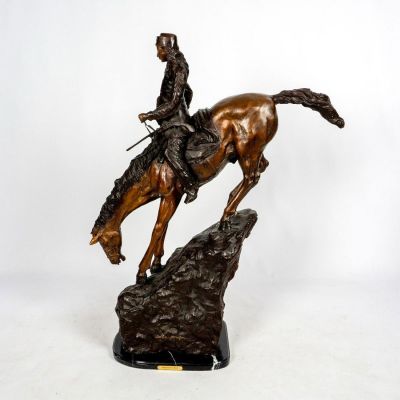 After Frederic Remington Bronze Sculpture, Mountain Man. Massive patinated bronze after Frederic 