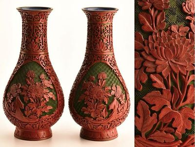 A pair of red floral patterned bottles for returning old collections. Height: 30cm,