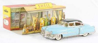 GAMA 300 1953 CADILLAC SEDAN. litho & painted tin, black & blue, 12", friction working