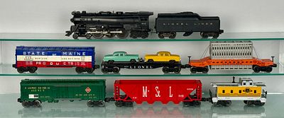 Lionel Train Set. Lionel O-gauge model trains, The set includes a black steam locomotive (#665) 