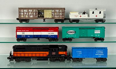 Lionel Train Set. Lionel Postwar O-gauge model railroad cars and one locomotive a black and 