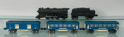 Lionel Train Set. A Lionel O-Gauge steam locomotive and passenger car set, primarily constructed 