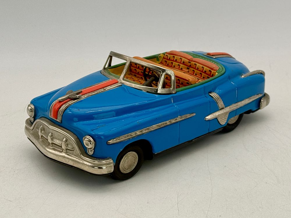 Lot 209: Yonezawa 1952 Oldsmobile Tin Friction Convertible Toy Car