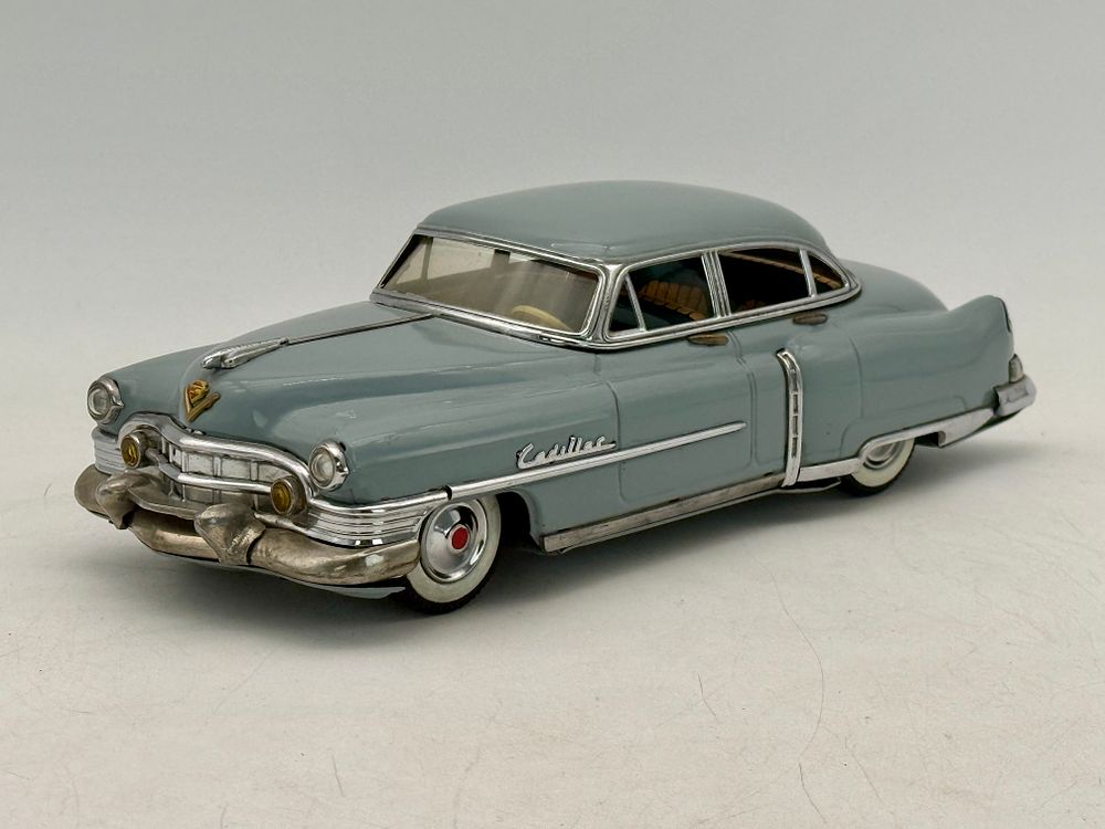 Lot 213: Marusan 1951 Cadillac Tin Friction Toy Car