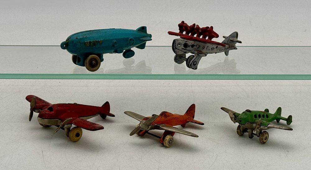 Lot 263: Five Cast Iron Airplanes