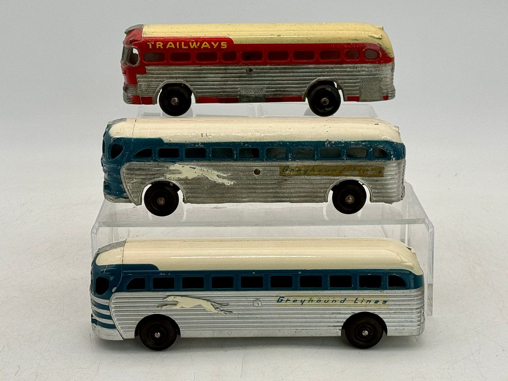 Lot 266: Three Dubuque/Ertl Diecast Greyhound and Trailways Toy Buses