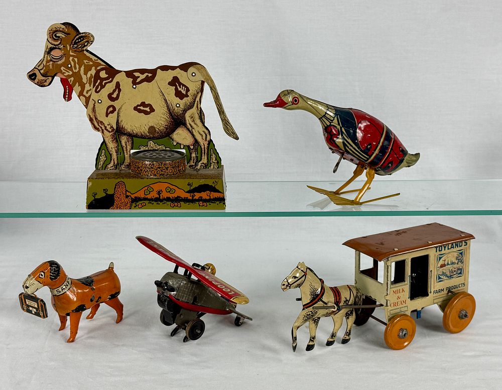 Lot 366: Five litho tin toys