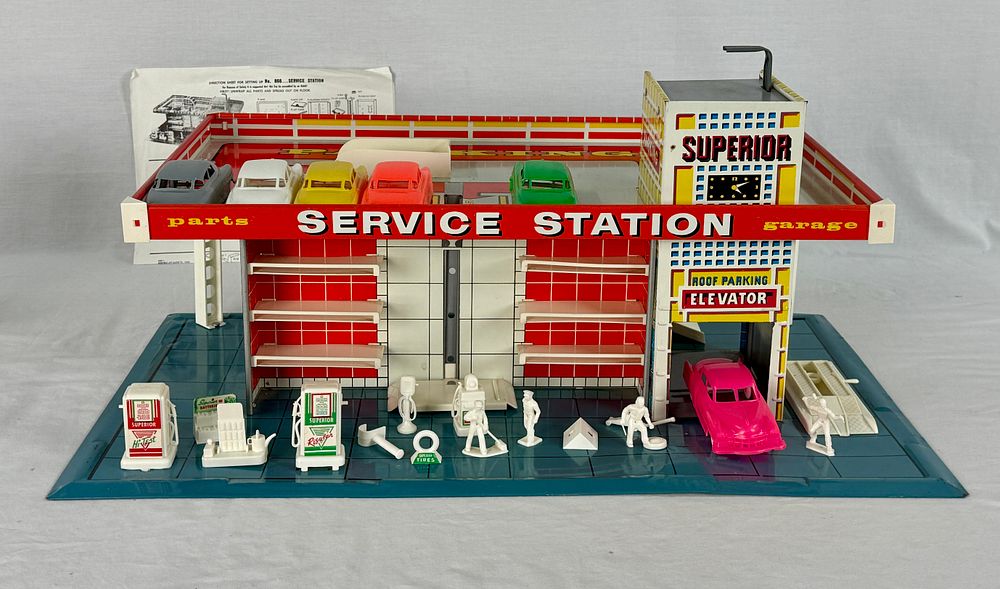 Lot 373: Vintage Brumberger Superior Service Station Tin Litho Playset with Six Cars