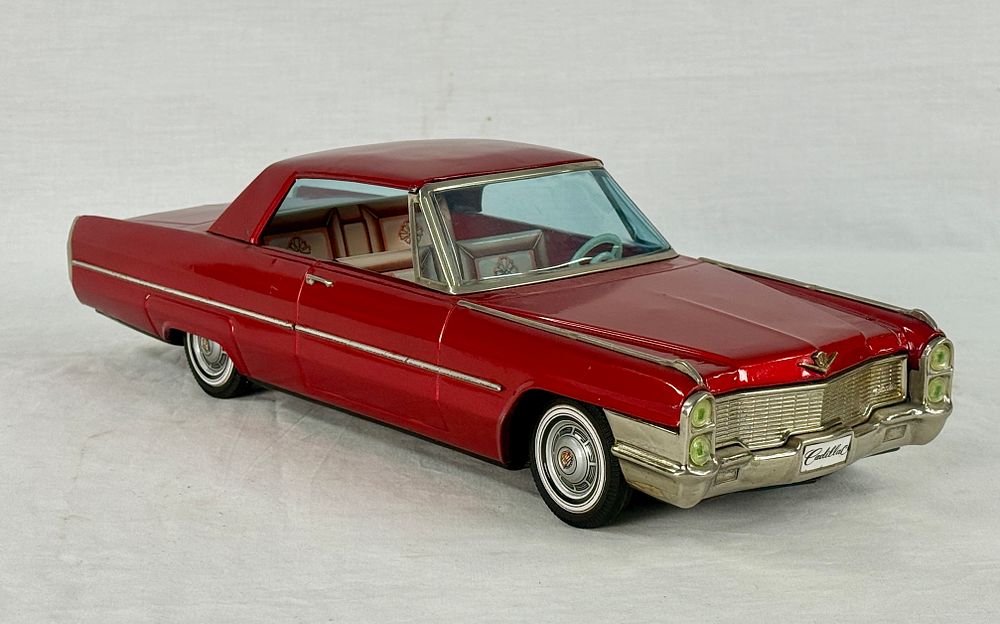 Lot 376: ATC Red 1965 Cadillac DeVille Toy Car