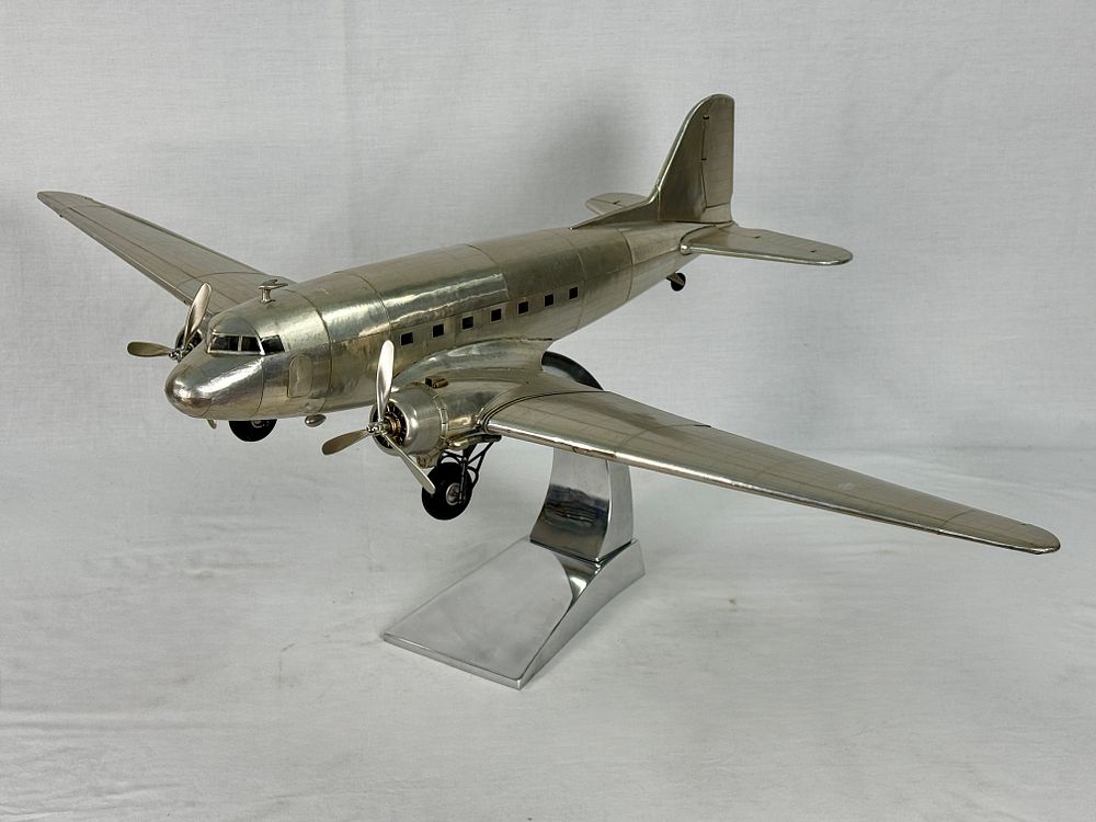 Lot 387: A Silver-Colored Metal Douglas DC-3 Model Airplane
