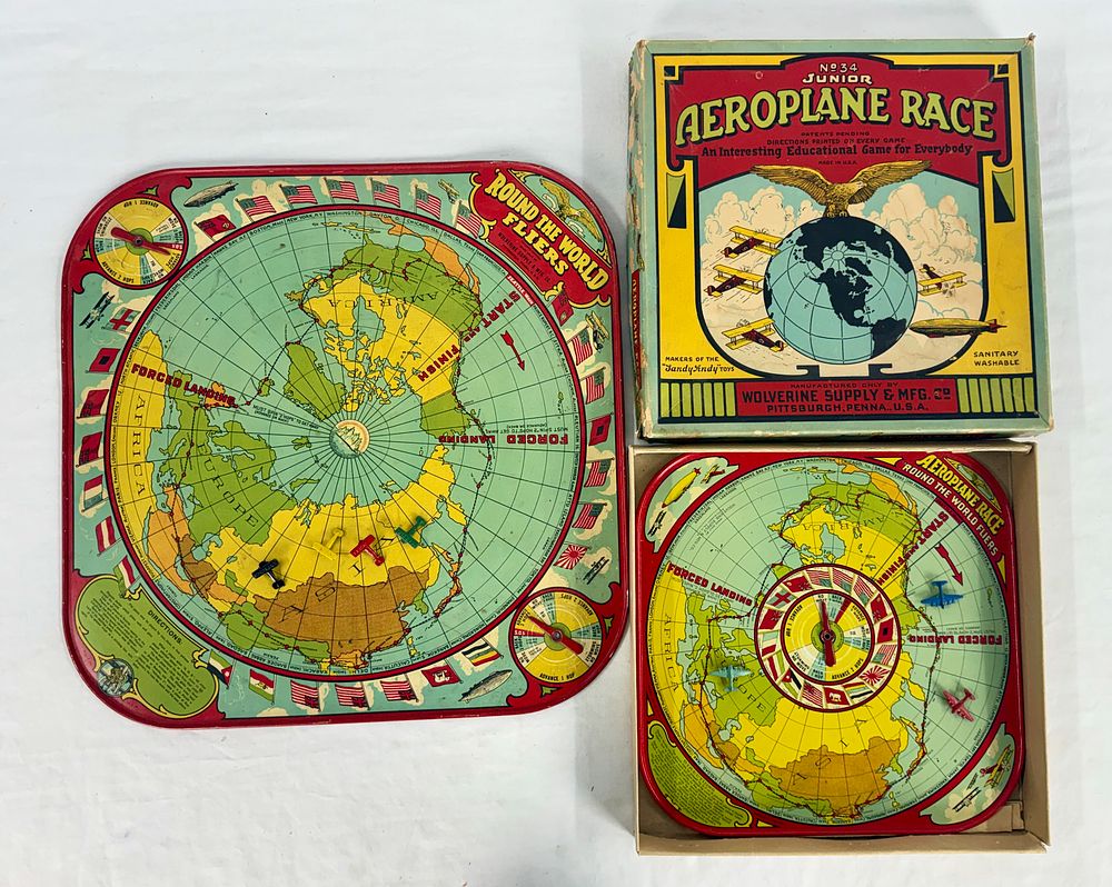 Lot 414: Collection of Vintage Wolverine Round The World Fliers Tin Games