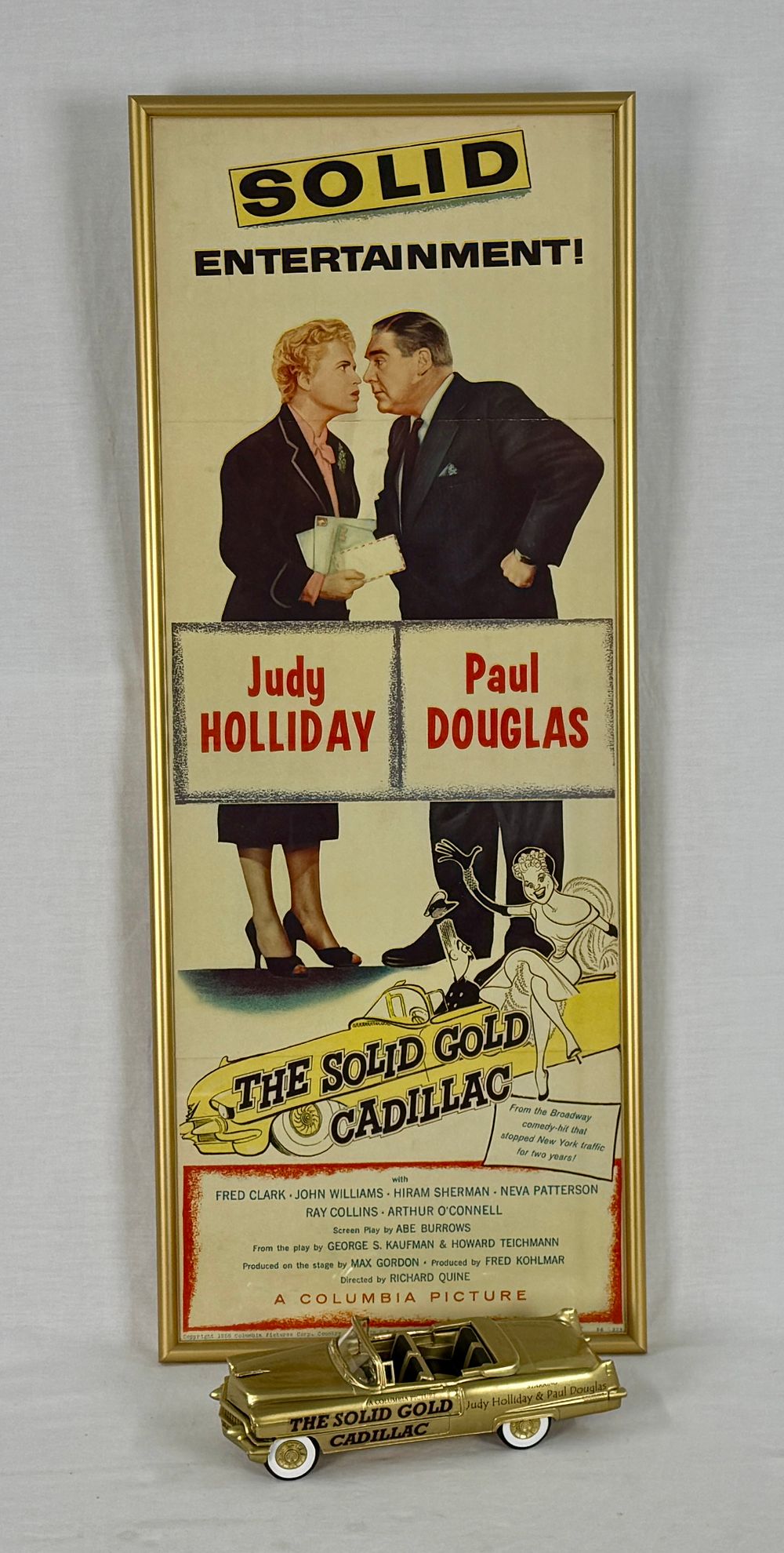 Lot 426: The Solid Gold Cadillac 1956 Movie Poster and Model Car