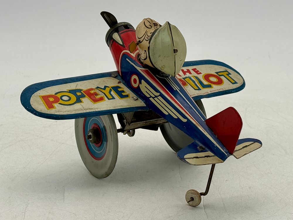 Lot 434: Marx Popeye The Pilot Tin Litho Wind-Up Airplane Toy