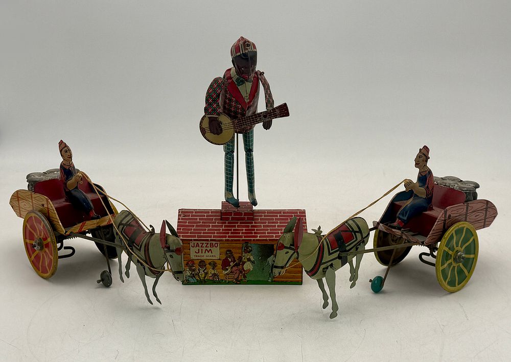 Lot 439: Three Tinplate Strauss Wind-Up Jazzbo Jim and Horse-Drawn Cart Toys