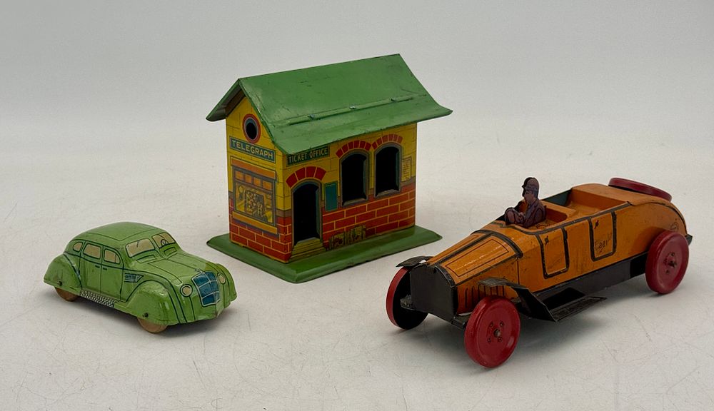Lot 441: Three Vintage Chein Tinplate Toy Cars and Train Station