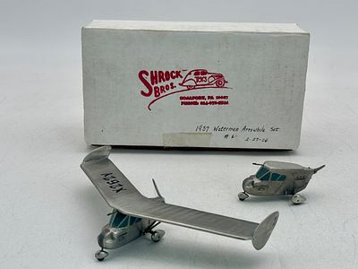 Shrock Bros. Toys 1937 Waterman Arrowbile Set. A silver-colored miniature set featuring a cabin 
