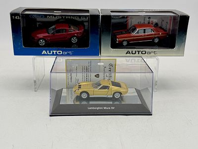 3 AUTOart 1:43 Scale Resin Model Cars. A trio of AUTOart 1:43 scale resin model cars including a 