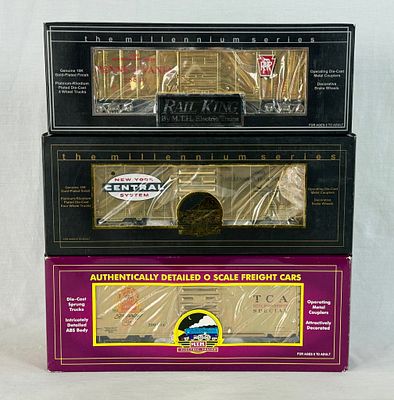Three M.T.H. Electric Trains O Scale Gold-Plated Model Freight Boxcars. Three M.T.H. Electric 