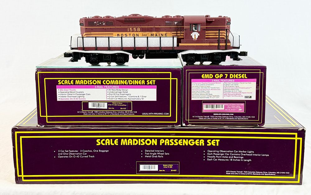 Lot 430: M.T.H. Electric Trains O-Gauge Boston and Maine GP-7 Diesel Locomotive and Madison Passenger Car Collection