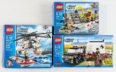 Three LEGO City Building Sets Including Coast Guard Helicopter 60013, Level Crossing 7936, and 