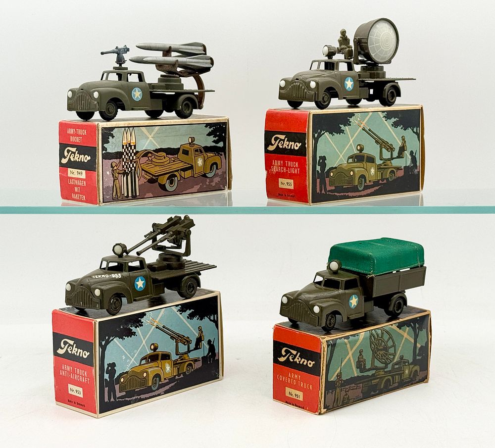 Lot 313: A Collection of Vintage Tekno Die-Cast Military Vehicles with Boxes