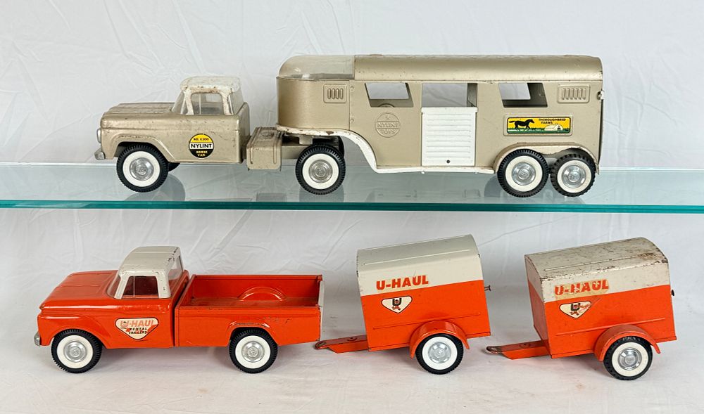 Lot 458: Nylint Pressed Steel U-Haul and Horse Van Toy Sets