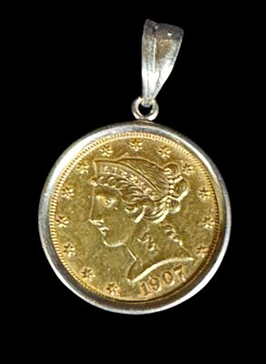 1907 LIBERTY FIVE DOLLAR GOLD COIN IN GOLD BEZEL. 1907 LIBERTY FIVE DOLLAR GOLD COIN IN A GOLD 