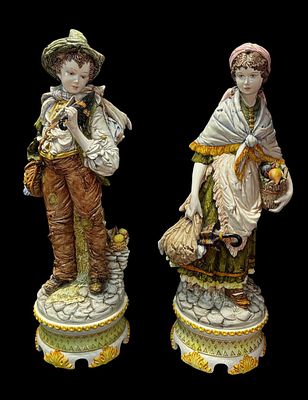 PAIR OF SIGNED MAJOLICA FIGURES, DEPICTING BOY AND GIRL SIGNED D. POLOUIATE. Height: 31.5 in. 