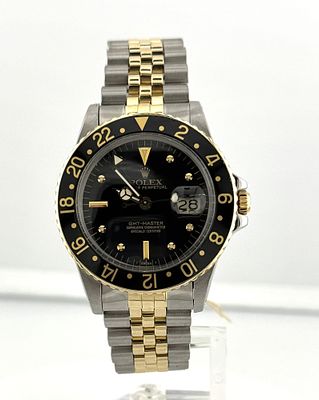 ROLEX STAINLESS 18KT YG GMT MASTER CHRONOMETER. ROLEX STAINLESS AND 18KT YG GMT MASTER ON A 