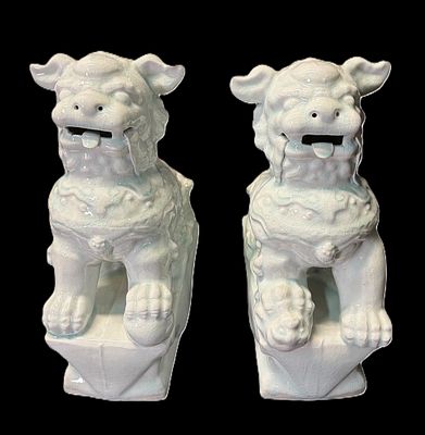 PAIR OF WHITE PORCELAIN ASIAN FOO DOGS. Height: 15 in. by Width: 5.75 in. by Depth: 12 in.